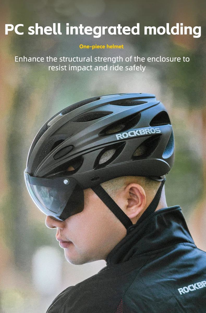 Child wearing a black helmet with goggles, featuring the brand 'RockBros', against a blurred natural background.